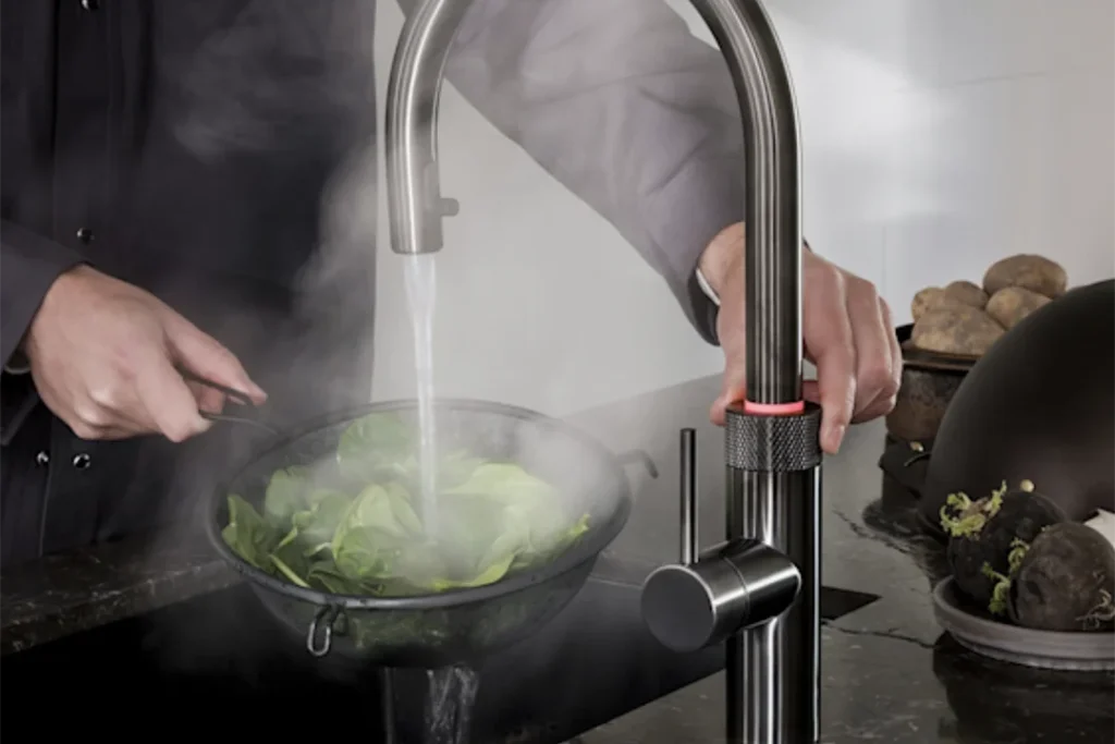 Quooker in Gun Metal showing boxing water blanching in close up